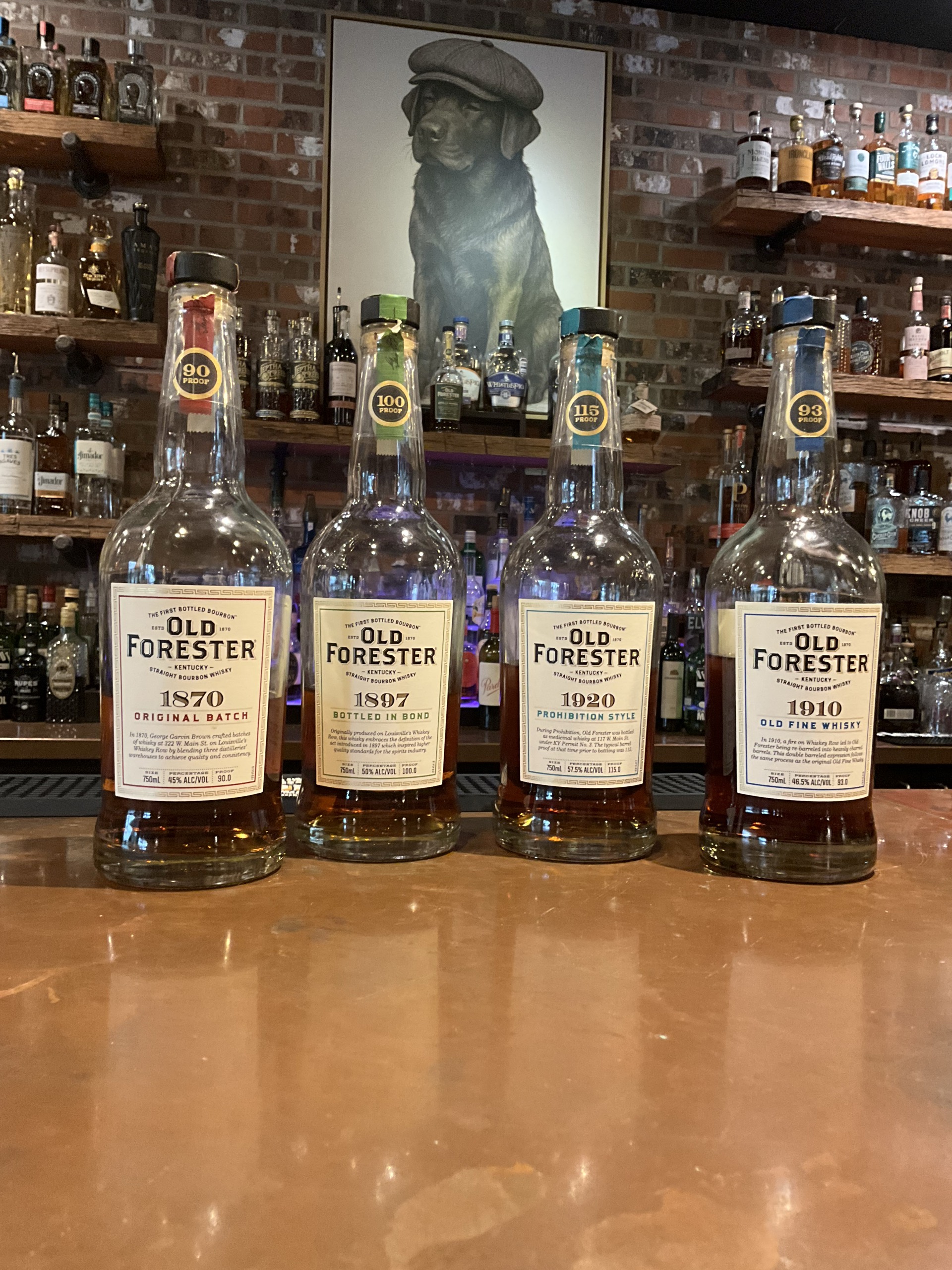 Four Old Forester whiskeys arranged for a vertical tasting